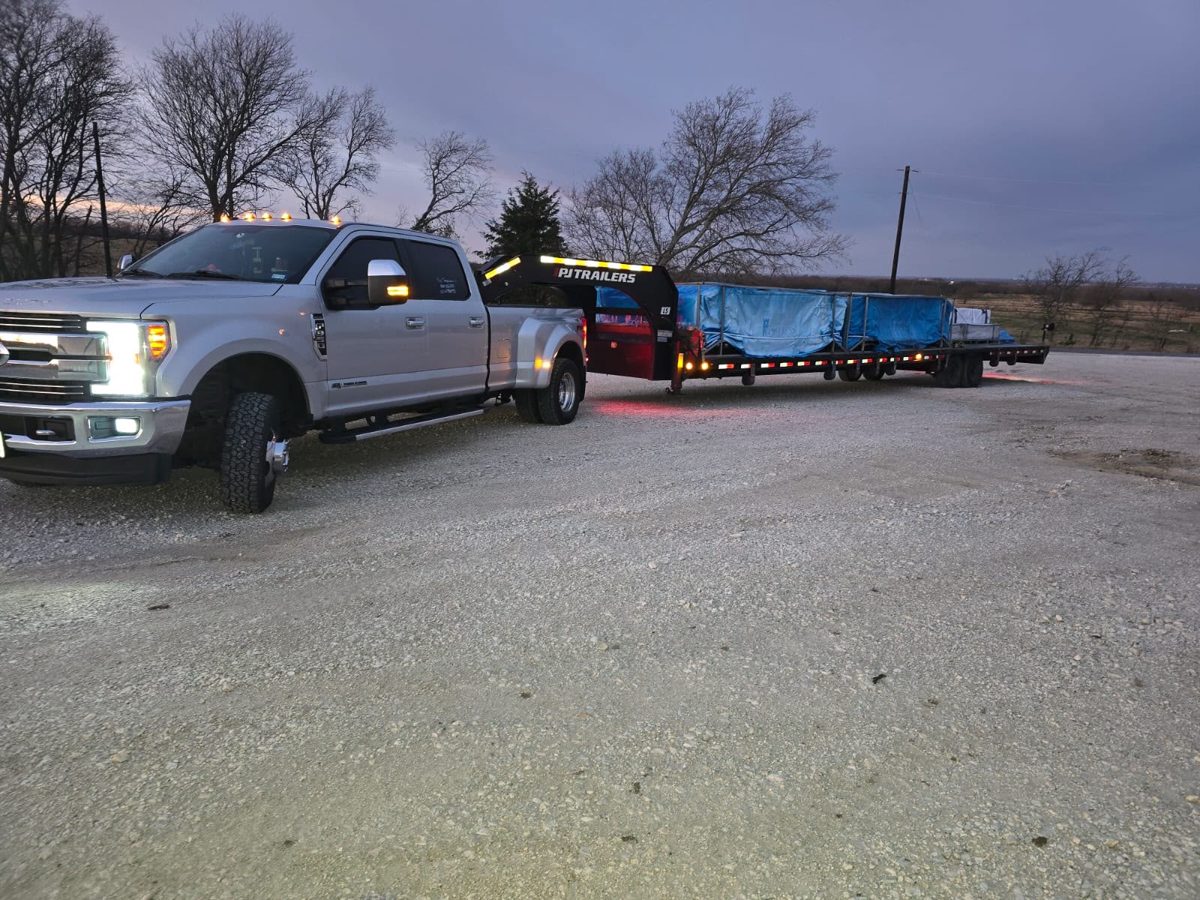 KHB truck and trailer on the road at dusk